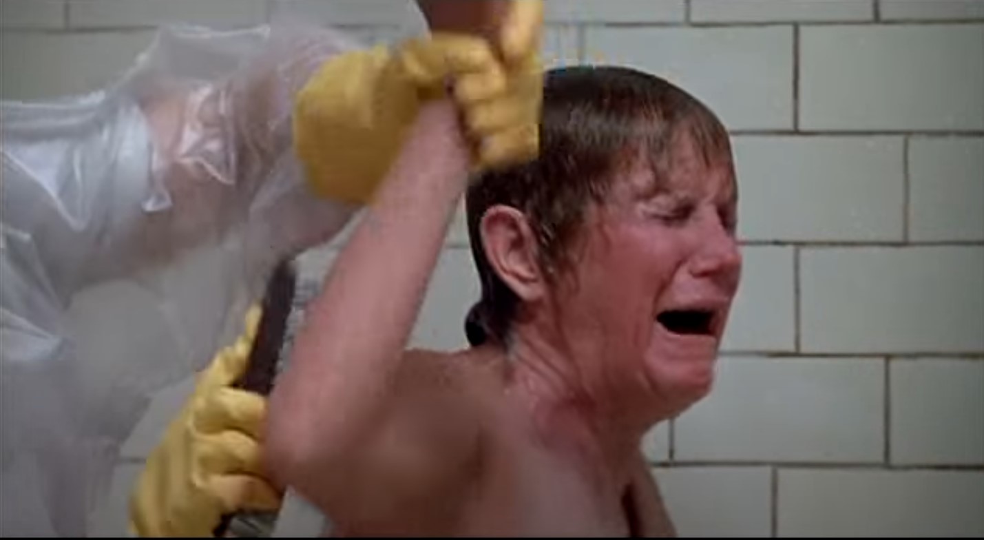 A radiation-exposed employee is forced to bathe (Source - movie Silkwood)