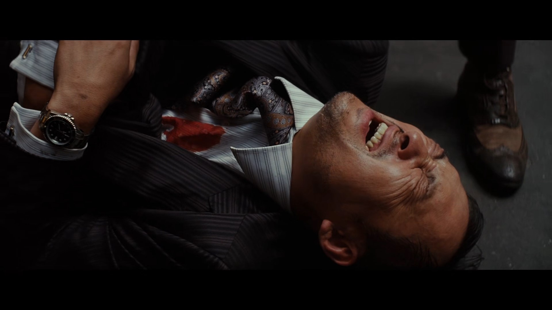 'Robert Fisher's' first stage dream in which 'Saito' is wounded by a gun (Source - movie Inception)